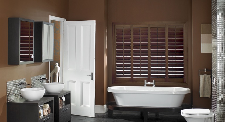 Stained wood shutter in Austin restroom